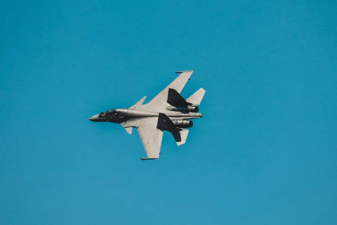 grey fighter jet under blue sky